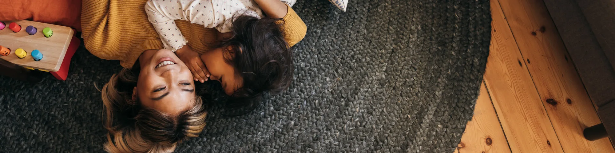 Mom and daughter playing on the floor